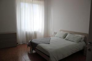 Letto o letti in una camera di B&B I due tigli