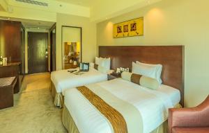 Widus Hotel Clark客房内的一张或多张床位