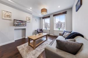 a living room with a couch and a coffee table at Majestic 4 at Reganway RW4 in London