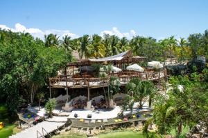 an aerial view of a resort with palm trees at Zenote Sanctuary in Tulum
