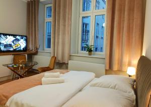 Posteľ alebo postele v izbe v ubytovaní Hugo Star Apartments