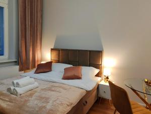Posteľ alebo postele v izbe v ubytovaní Hugo Star Apartments