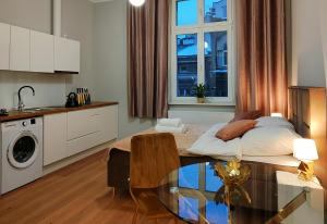 Kuchyňa alebo kuchynka v ubytovaní Hugo Star Apartments