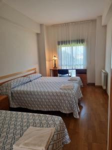 Posteľ alebo postele v izbe v ubytovaní Casa Diocesana VIA LUCIS
