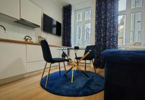 Televízia a/alebo spoločenská miestnosť v ubytovaní Hugo Star Apartments