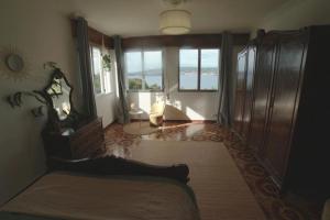 A bed or beds in a room at Primero Seixo antiguo