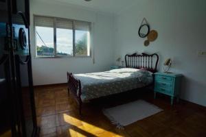 A bed or beds in a room at Primero Seixo antiguo