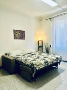 Postel nebo postele na pokoji v ubytování Bertolazzi Apartment + 15 fotografií