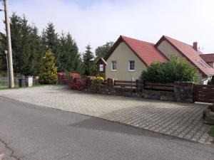 a house with a fence and a brick driveway at Tisá 488 in Tisá +28 photos