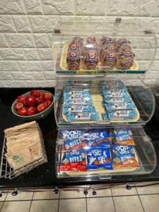 a refrigerator filled with lots of different types of food at BaySide Inn & Suites Eureka in Eureka