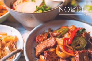 a bowl of food with meat and vegetables on a table at SAHARA Las Vegas in Las Vegas