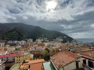 a view of a city with buildings and a mountain at Casa Muse in Maiori