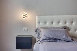 A bed or beds in a room at Appartamento lussuoso climatizzato a 200 m dal mare