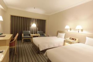 Voodi või voodid majutusasutuse Santos Hotel toas