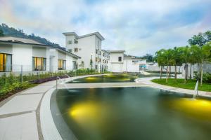 a swimming pool in the middle of a house at ēRYA by SURIA Hot Spring Bentong in Bentong