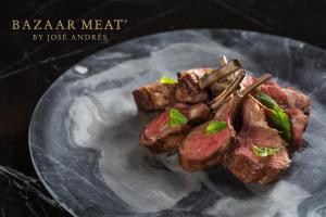 a plate of food with meat and chop sticks at SAHARA Las Vegas in Las Vegas