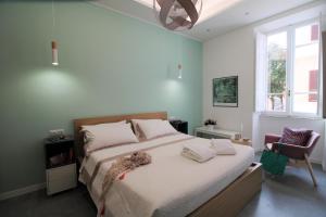 En eller flere senge i et værelse på Veniero37 Guest House