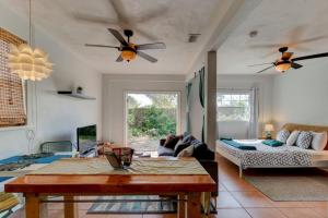 a living room with a table and a couch at Spanish Bungalow Guest House in Daytona Beach