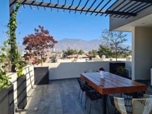 a table on the roof of a house with a view at Casa Moreno Deluxe in Ameca