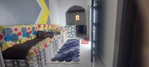 a room with a couch with shoes on it at Abo Tamem Guest House in Aswan +11 photos