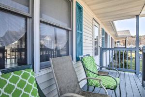 a porch with two chairs and two windows at Milton Townhouse about 9 Mi to Delaware Bay! in Milton