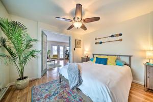 a bedroom with a bed and a ceiling fan at Portland Floating Home Getaway with Sauna! in Portland