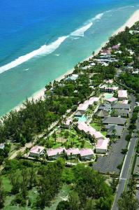 an aerial view of a resort next to the beach at Hotel Le Recif, Ile de la Reunion in Saint-Gilles-les-Bains