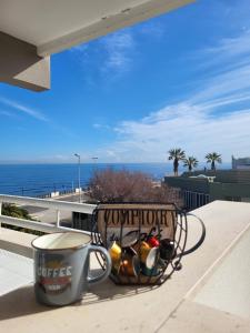 a cup of coffee on a balcony with a cup of coffee at Casa al Mare in Bari