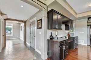 a kitchen with wooden cabinets and a counter top at Large Executive Home in Mill Springs , 4 bd and 3 ba in Mill Bay