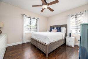 a bedroom with a bed and a ceiling fan at Home at Poinsettia Heights in Fort Lauderdale