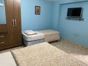 En eller flere senge i et værelse på Hotel Itavera
