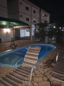 Der Swimmingpool an oder in der Nähe von Apart-Hotel Ijuí