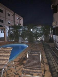 Der Swimmingpool an oder in der Nähe von Apart-Hotel Ijuí