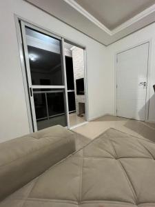 Ένα ή περισσότερα κρεβάτια σε δωμάτιο στο Apart-Hotel Ijuí