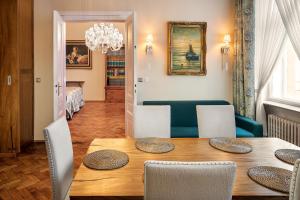 a dining room with a table and chairs at BHG Apartments Prague in Prague