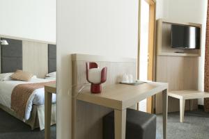 Postel nebo postele na pokoji v ubytování Hotel Casa Valdese Roma