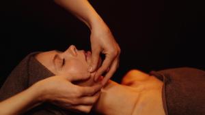 a woman with her hands on her face at Ukstiņa Holiday apartment in Liepāja