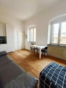 a living room with a table and a dining room at Casa di Matteo Ponterotto 34(zona brignole) in Genoa