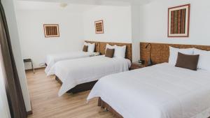 Postel nebo postele na pokoji v ubytování Faraona Grand Hotel