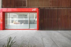 a store front with a red door with the number at Urban Getaway, Trendy Polanco, Home Office in Mexico City