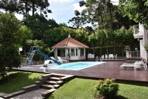 A piscina localizada em Doce Canela - Pousada de Charme ou nos arredores