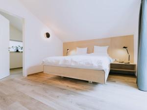 Postel nebo postele na pokoji v ubytování Gourmet - Boutique Hotel Tanzer