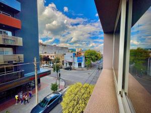 a view of a city street from a window of a building at Departamento Güemes II in San Salvador de Jujuy