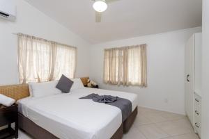 Postel nebo postele na pokoji v ubytování Moana Sands Beachfront Villas