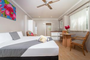 Postel nebo postele na pokoji v ubytování Moana Sands Beachfront Villas