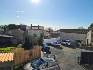 a group of cars parked in a parking lot at LOCATION T2 in Chenac-sur-Gironde