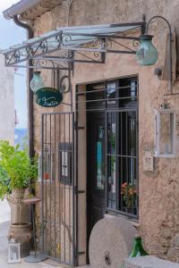 an entrance to a building with a gate and a door at Tiny house in the historic centre of Soverato in Soverato Superiore