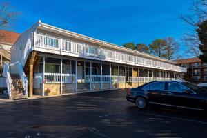 a black car parked in front of a building at Fenwick Woods OC in Ocean City
