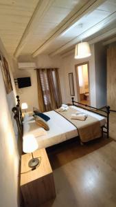 Postel nebo postele na pokoji v ubytování La Terrazza Di Athena sweet rooms