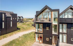 an aerial view of a house with glass windows at Lovely Home In Skagen With House Sea View in Skagen